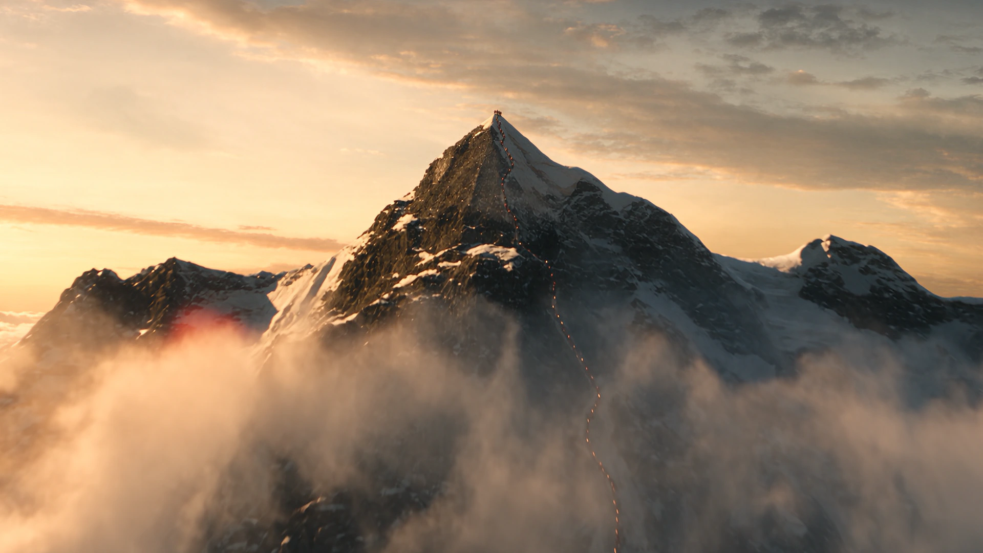 A mountain ridge above cloud at first light.